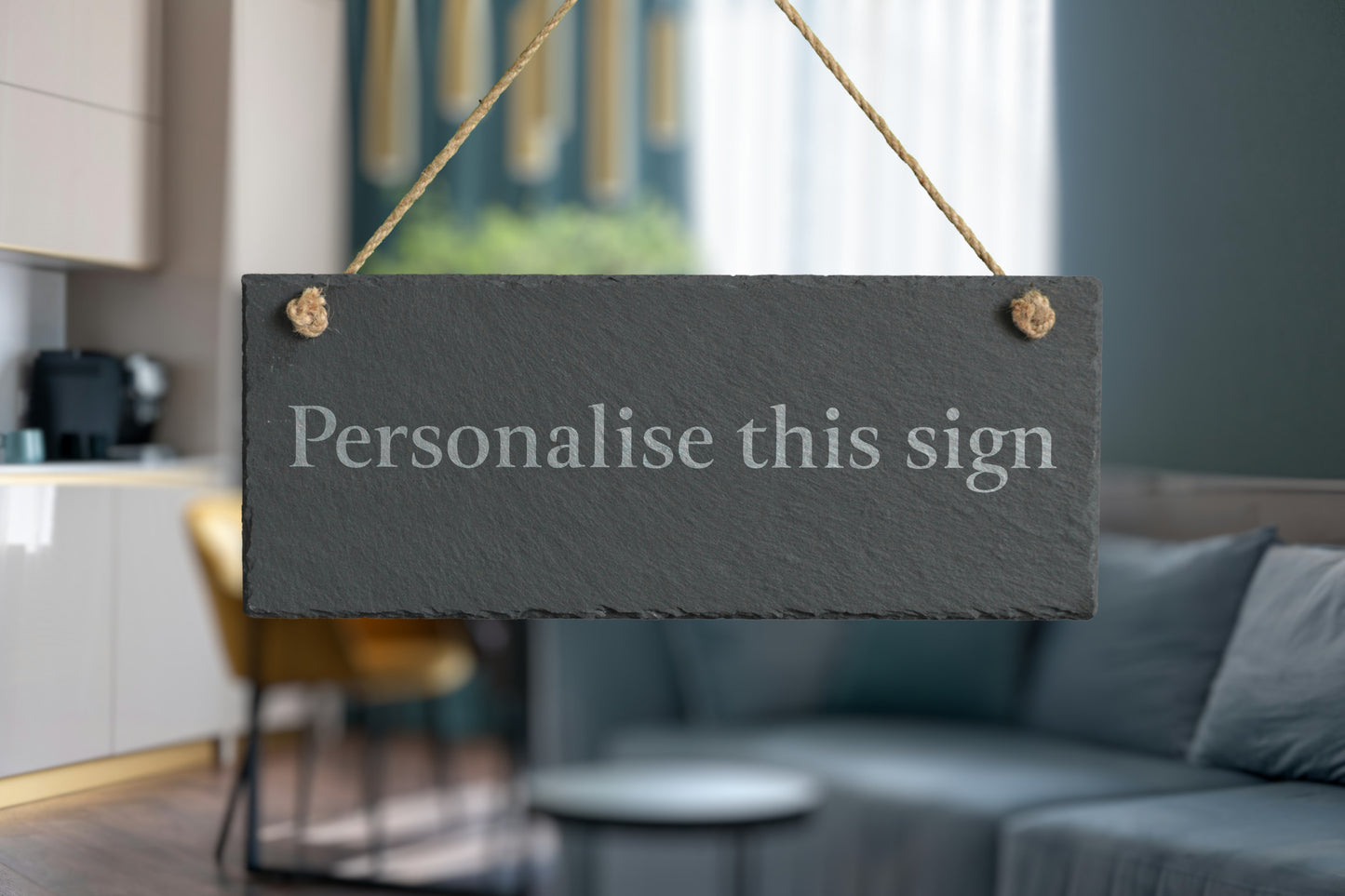 Slate sign with 'Personalise this sign' text in a living room setting